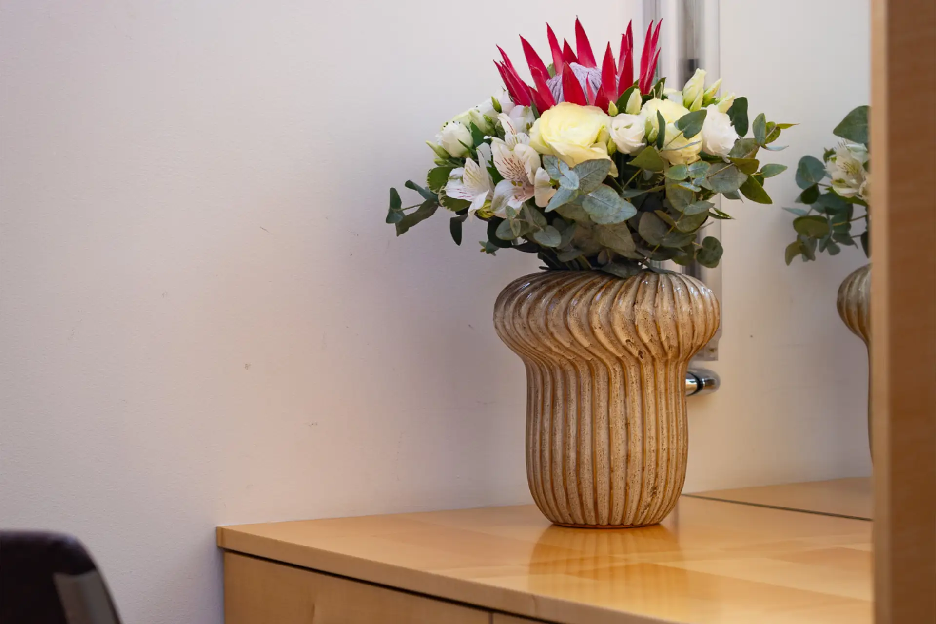 HOTEL-CREINA---deluxe-suite---3-second-double-bed-with-flowers